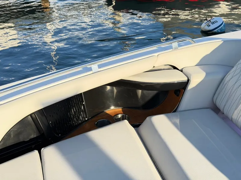 Slide: The Image of The 2022 Sea Ray Sundancer 370 Outboard features a sleek, cushioned deck area with cup holders. - 44