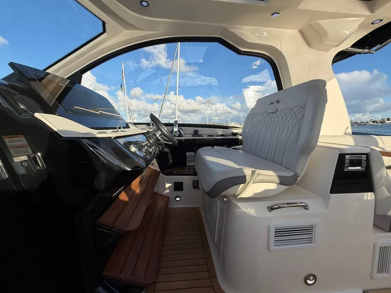 Slide: The Image of Interior of the 2022 Sea Ray Sundancer 370 Outboard with sleek seating and modern controls. - 29