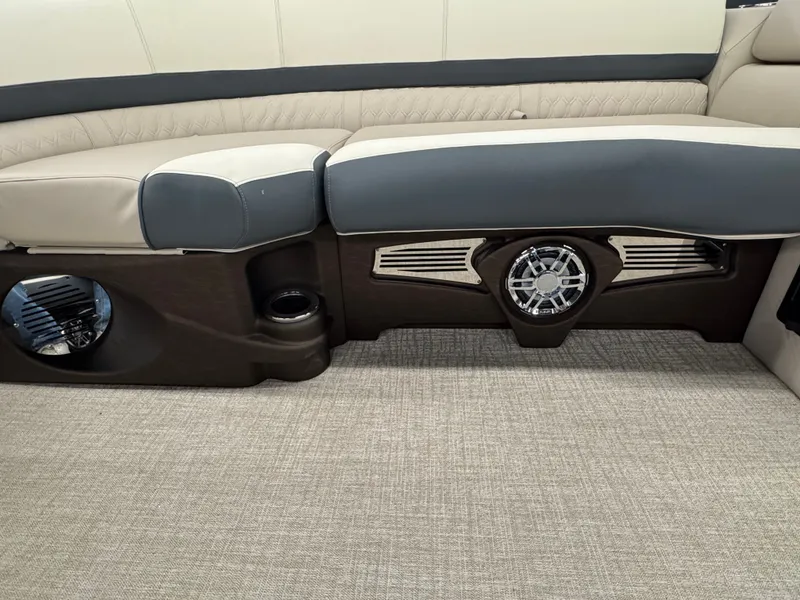 Slide: The Image of Interior of the Tahoe Cascade 2385 QLS with sleek seating and built-in speaker. - 7