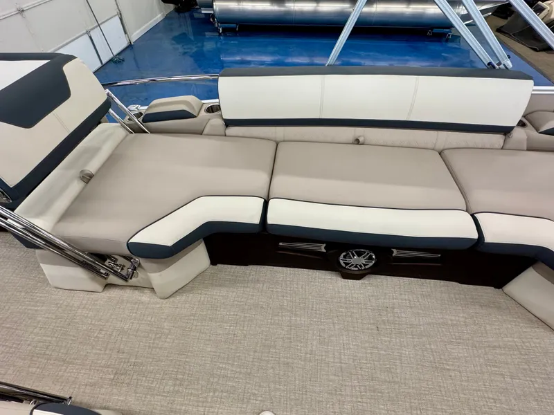 Slide: The Image of The image shows the interior of a 2025 Tahoe Cascade 2385 QLS with sleek, cream-colored upholstery. - 16