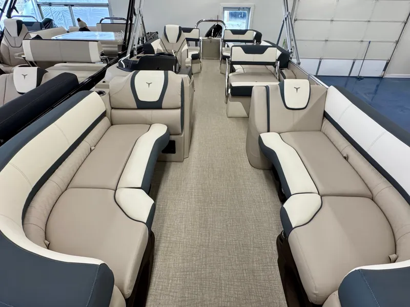Slide: The Image of Interior view of a luxury pontoon boat with beige and gray seating and modern design. - 6