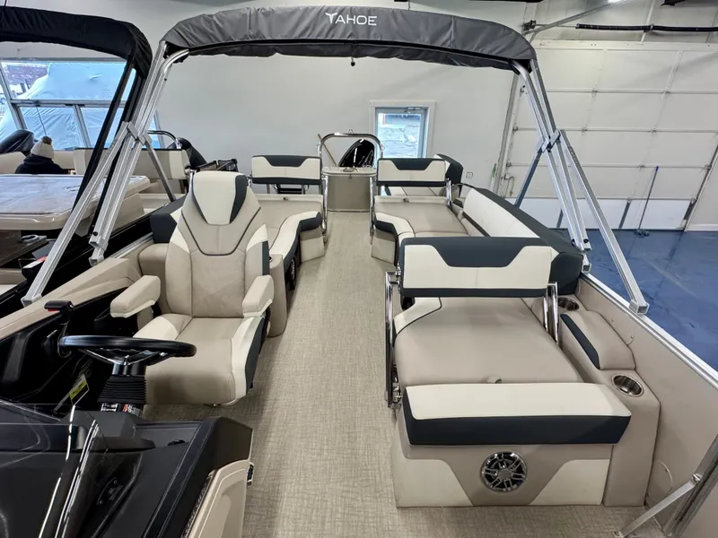 Slide: The Image of The image shows the interior of a 2025 Tahoe Cascade 2385 QLS pontoon boat with sleek seating. - 10