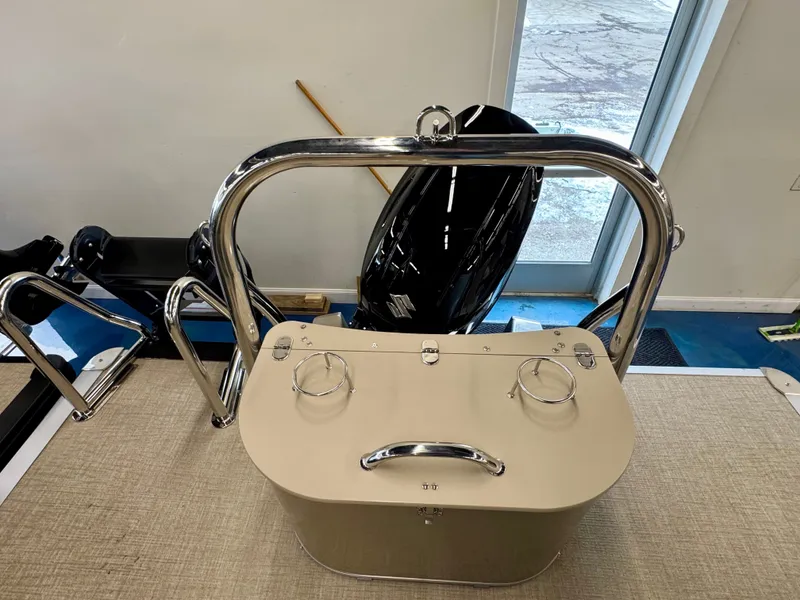 Slide: The Image of The image shows the rear of a boat with a stainless steel railing and an outboard motor. - 19
