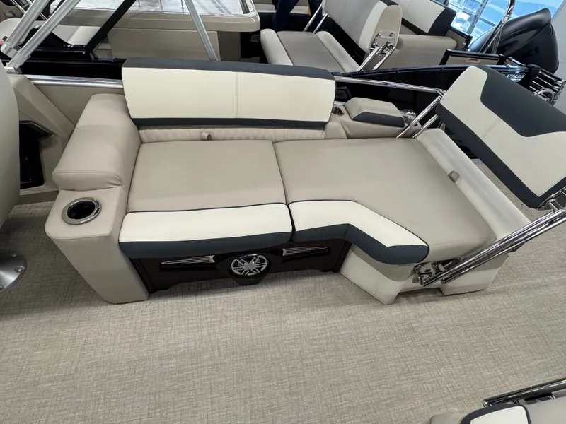 Slide: The Image of The image shows a luxurious seating area on a boat with beige and dark gray upholstery. - 15