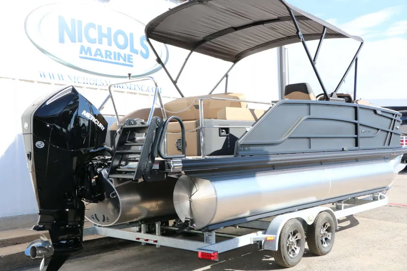 Slide: The Image of A 2027 Evotti 521 CS Tri Toon on a trailer, featuring a Mercury outboard motor. - 18