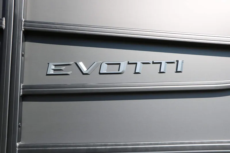 Slide: The Image of Close-up of the Evotti logo on a gray boat. - 15