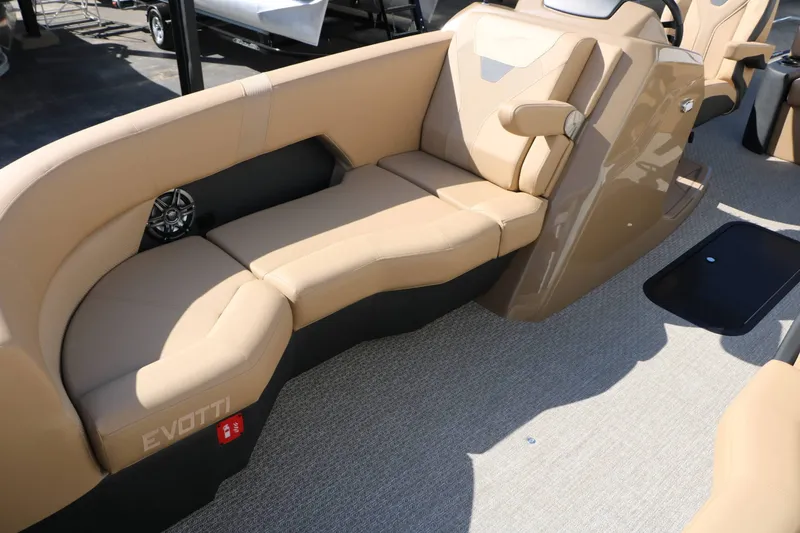 Slide: The Image of The image shows the beige interior of a 2027 Evotti 521 CS Tri Toon boat. - 30