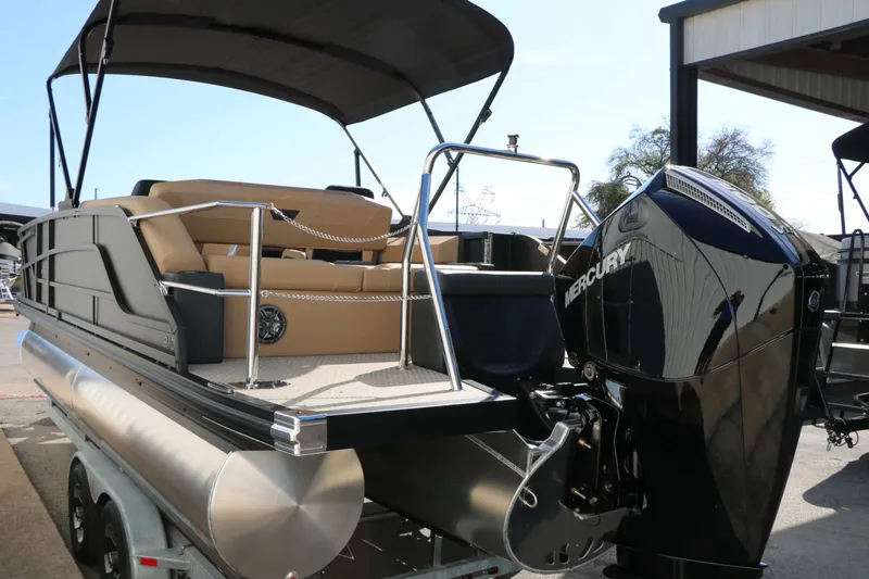 Slide: The Image of The image shows an Evotti 521 CS Tri Toon boat with a Mercury outboard motor. - 23