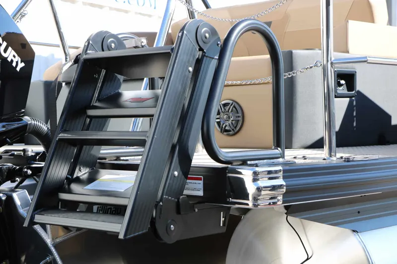 Slide: The Image of The 2027 Evotti 521 CS Tri Toon features a sturdy swim ladder and sleek seating. - 27