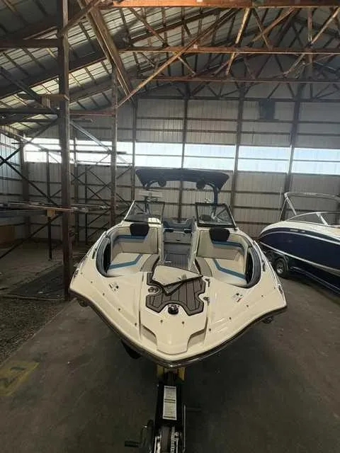 Slide: The Image of A 2018 Yamaha 242X boat inside a storage warehouse. - 3