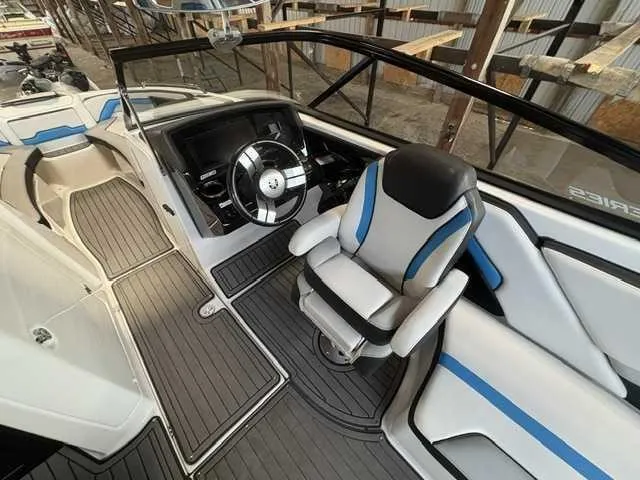 Slide: The Image of The image shows the cockpit of a 2018 Yamaha 242X boat with a modern helm. - 5