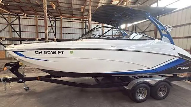Slide: The Image of 2018 Yamaha 242X in a warehouse, mounted on a trailer. - 2