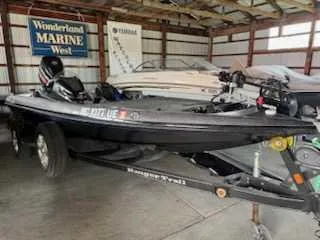The Image of A black 2017 Ranger Z519C boat is parked in a storage facility. - 0