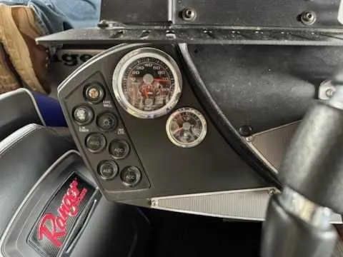 Slide: The Image of The image shows the dashboard of a 2017 Ranger Z519C boat with various gauges and switches. - 7