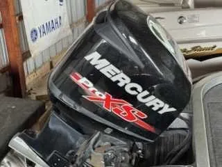 Slide: The Image of A Mercury Pro XS outboard motor is mounted on a boat. - 12
