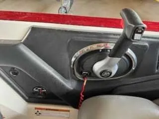 Slide: The Image of Close-up of the throttle lever on a Ranger Z520 Comanche boat. - 13