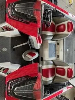Slide: The Image of The image shows the cockpit of a Ranger Z520 Comanche boat with red and gray seats. - 7