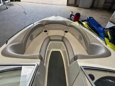 Slide: The Image of The image shows the bow of a 2009 Yamaha AR230 boat with beige upholstery. - 3