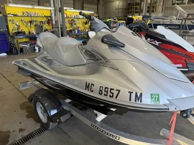 The Image of A gray 2012 Yamaha VX Cruiser jet ski on a trailer in a workshop. - 0