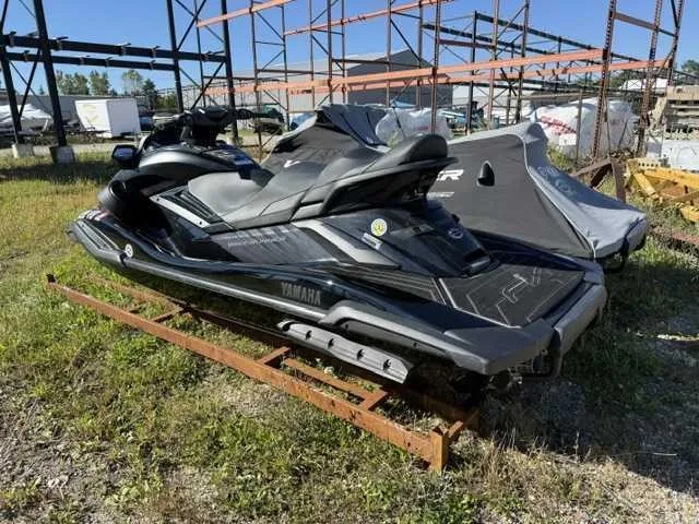 Slide: The Image of A 2025 Yamaha WaveRunner FX Cruiser SVHO sits on a metal frame outdoors. - 2