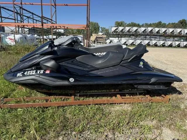 Slide: The Image of A black 2025 Yamaha WaveRunner FX Cruiser SVHO sits on a metal stand outdoors. - 1