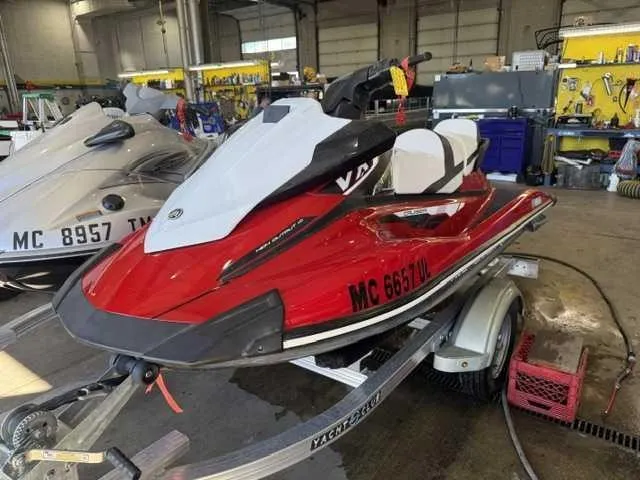 Slide: The Image of A red 2018 Yamaha VX Cruiser jet ski on a trailer in a workshop. - 1