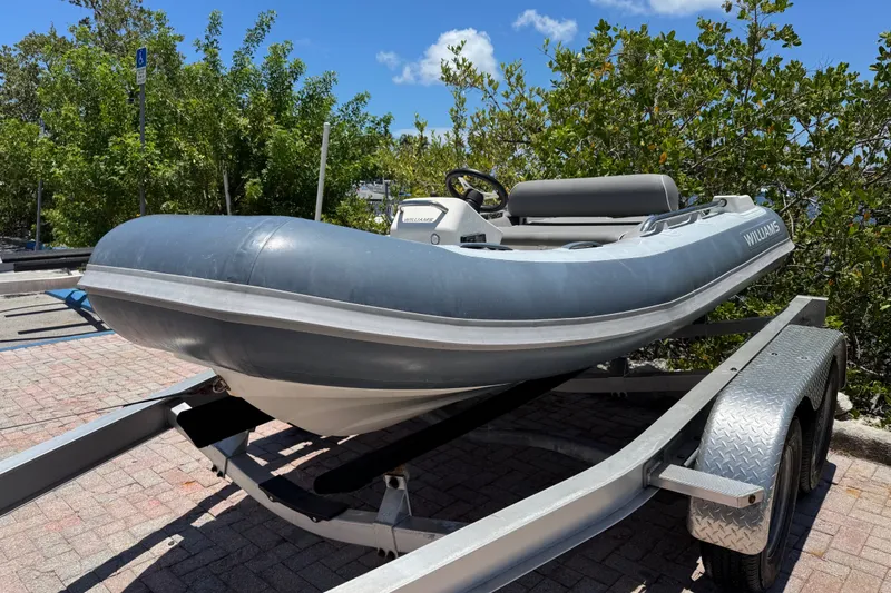 Slide: The Image of 2019 Williams Jet Tenders Sportjet 345 on trailer, parked outdoors. - 3