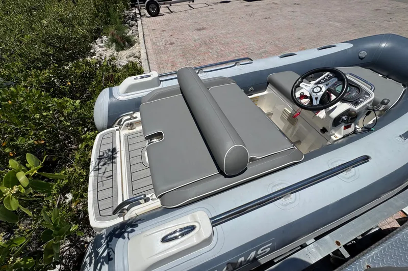Slide: The Image of 2019 Williams Jet Tenders Sportjet 345 with gray seating and steering console. - 9