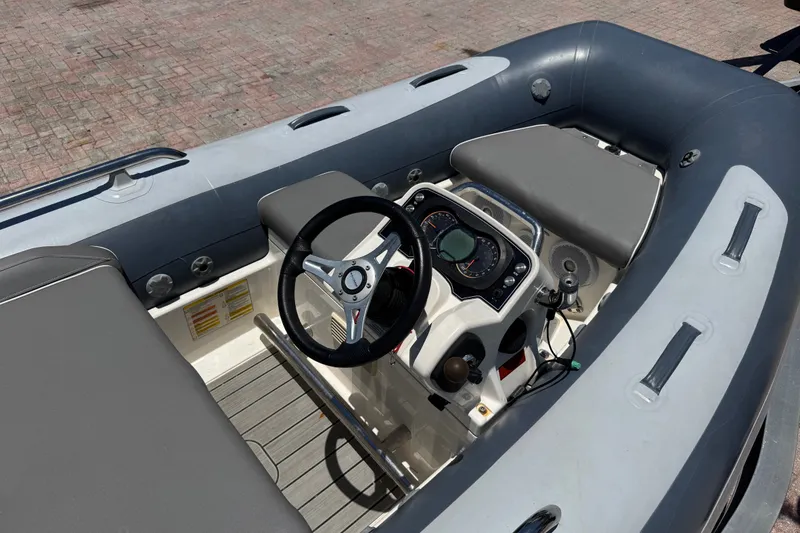 Slide: The Image of 2019 Williams Jet Tenders Sportjet 345 interior with steering wheel and dashboard. - 14