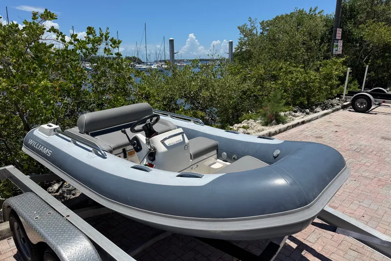 Slide: The Image of 2019 Williams Jet Tenders Sportjet 345 on trailer by waterfront. - 7