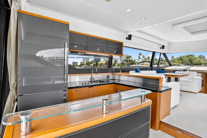 Slide: The Image of Luxurious interior of a 2013 Prestige 620 yacht with modern kitchen and seating area. - 30