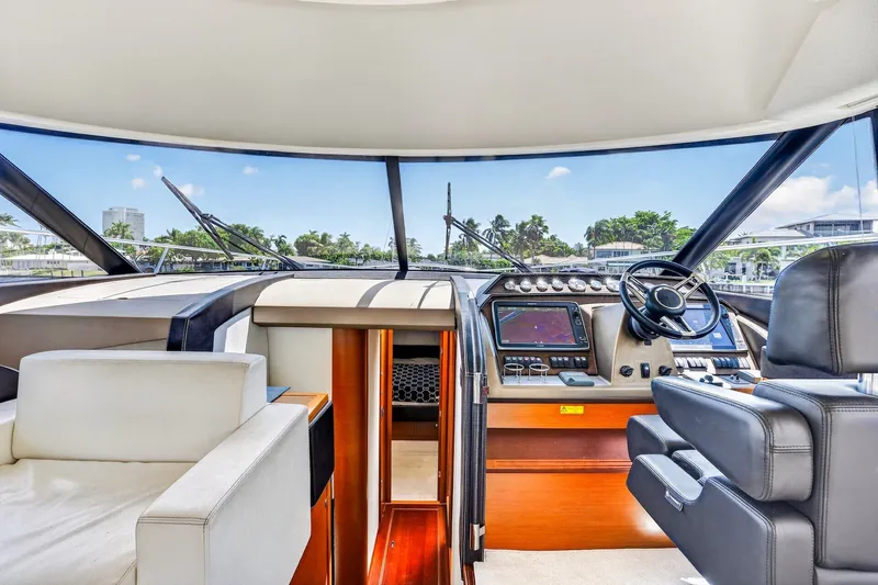 Slide: The Image of Interior view of 2013 Prestige 620 yacht cockpit with modern navigation equipment. - 36