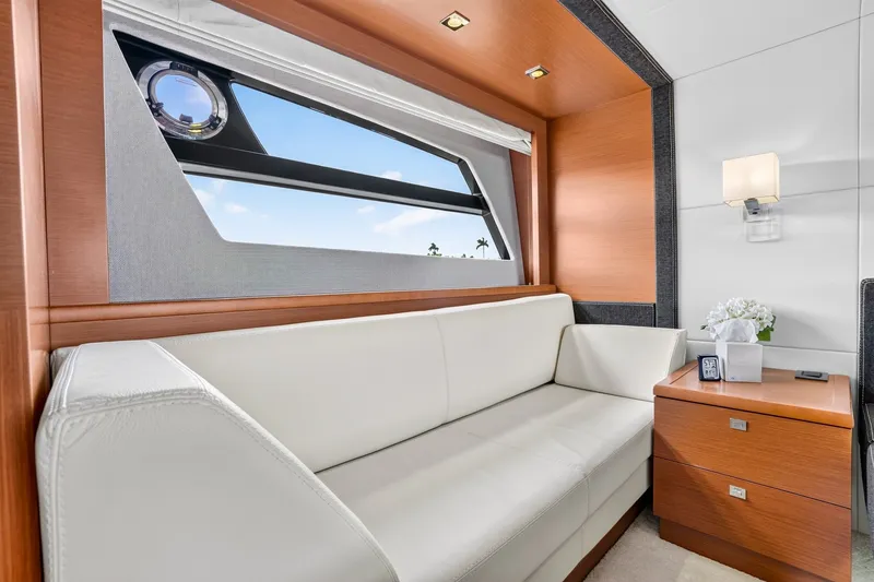 Slide: The Image of Luxurious interior of 2013 Prestige 620 yacht with white sofa and wooden accents. - 45