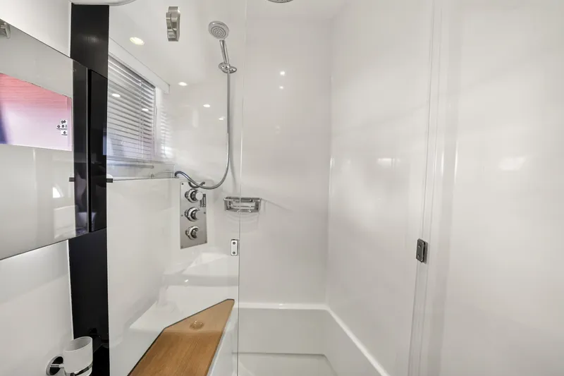 Slide: The Image of Modern shower area in a 2013 Prestige 620 yacht, featuring sleek design and fixtures. - 47