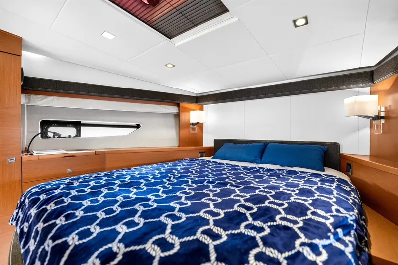 Slide: The Image of Luxurious cabin interior of 2013 Prestige 620 yacht with elegant bedding and modern lighting. - 50