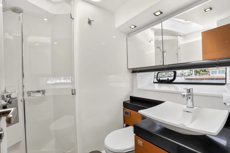 Slide: The Image of Luxurious bathroom interior of 2013 Prestige 620 yacht with modern fixtures and sleek design. - 56