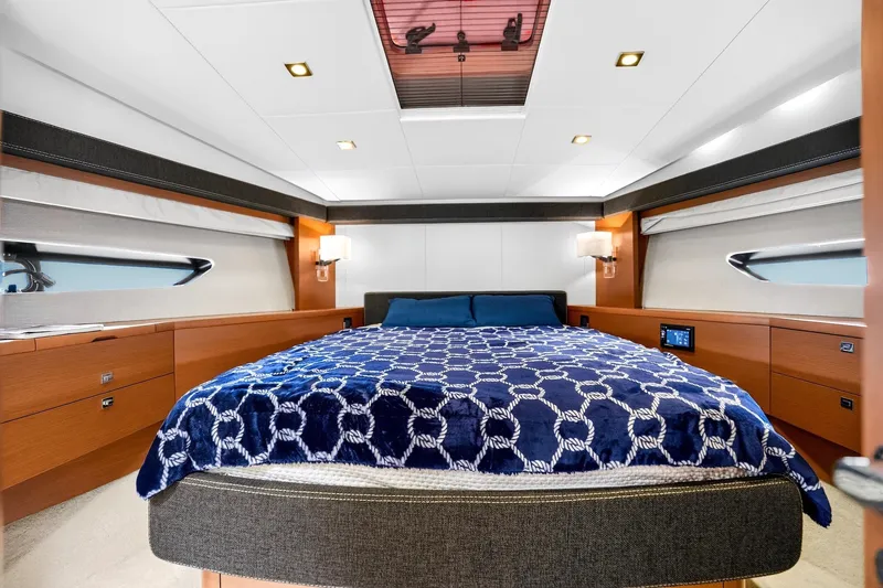 Slide: The Image of Luxurious cabin interior of 2013 Prestige 620 yacht with elegant bedding and modern design. - 49