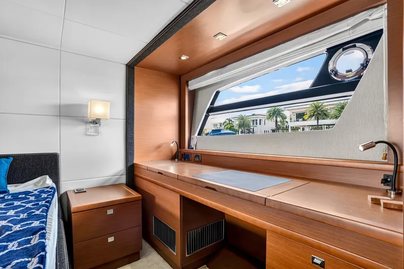 Slide: The Image of Luxurious cabin interior of a 2013 Prestige 620 yacht with a scenic window view. - 44