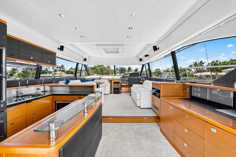 Slide: The Image of Luxurious interior of 2013 Prestige 620 yacht with modern kitchen and seating area. - 31