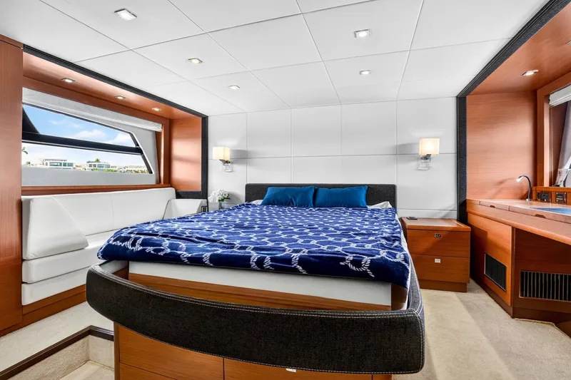 Slide: The Image of Luxurious cabin interior of 2013 Prestige 620 yacht with modern furnishings and large bed. - 41