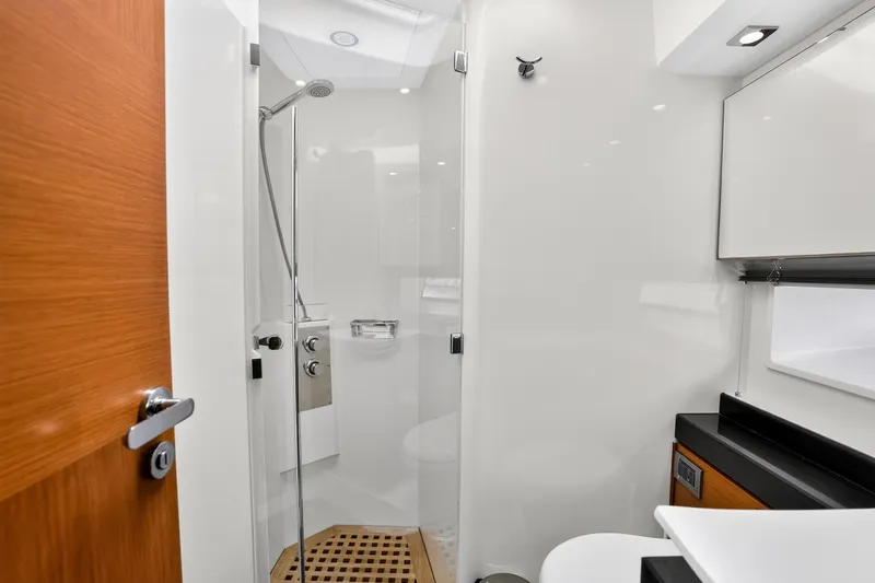 Slide: The Image of Luxurious bathroom interior of 2013 Prestige 620 yacht with modern shower and sleek design. - 57