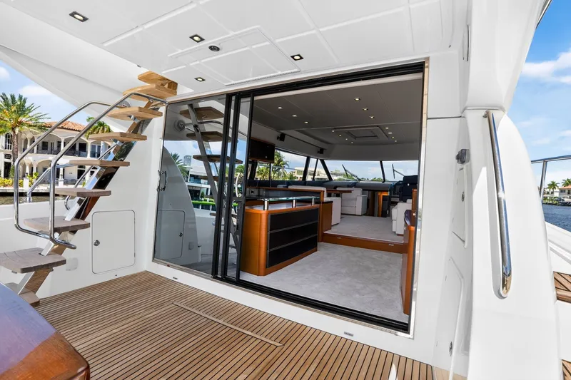 Slide: The Image of Luxurious 2013 Prestige 620 yacht interior with wooden deck and modern furnishings. - 24