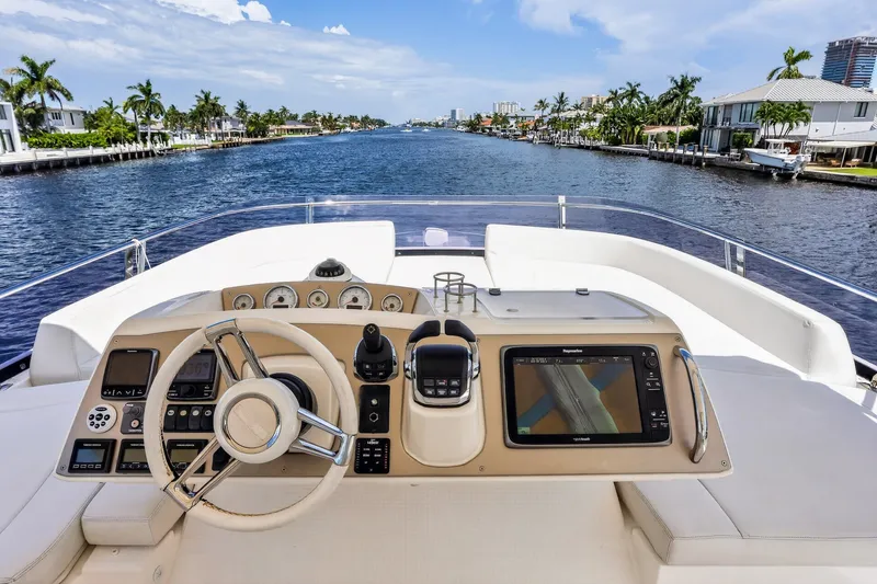 Slide: The Image of Cockpit view of 2013 Prestige 620 yacht navigating a scenic waterway. - 20
