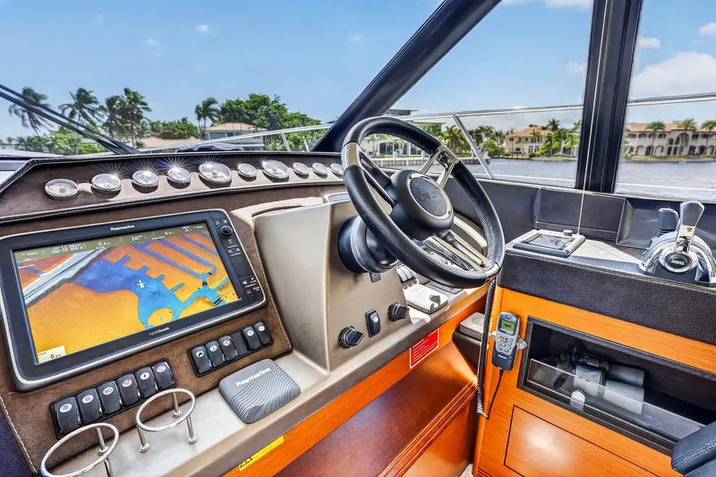 Slide: The Image of Cockpit of 2013 Prestige 620 yacht with navigation system and steering wheel. - 37