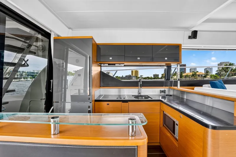Slide: The Image of Luxurious interior of a 2013 Prestige 620 yacht with modern kitchen amenities. - 27