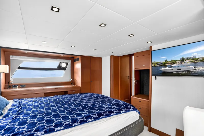 Slide: The Image of Luxurious cabin interior of 2013 Prestige 620 yacht with modern decor and large window. - 40