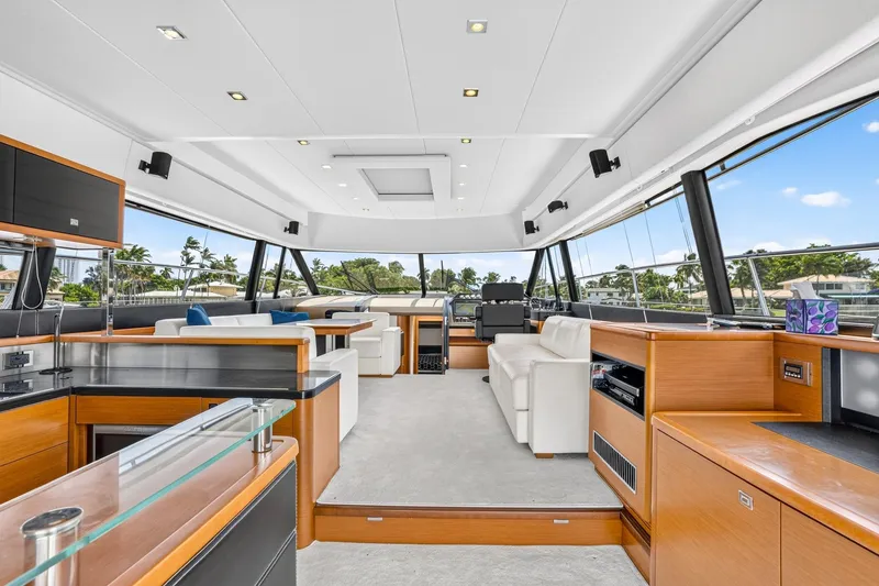 Slide: The Image of Luxurious interior of a 2013 Prestige 620 yacht with modern furnishings and panoramic windows. - 26