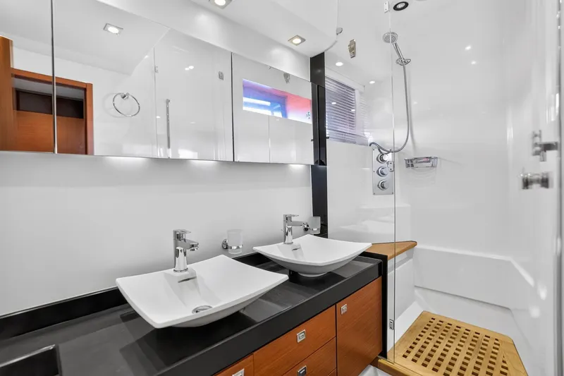 Slide: The Image of Luxurious bathroom in 2013 Prestige 620 yacht with dual sinks and modern shower. - 46