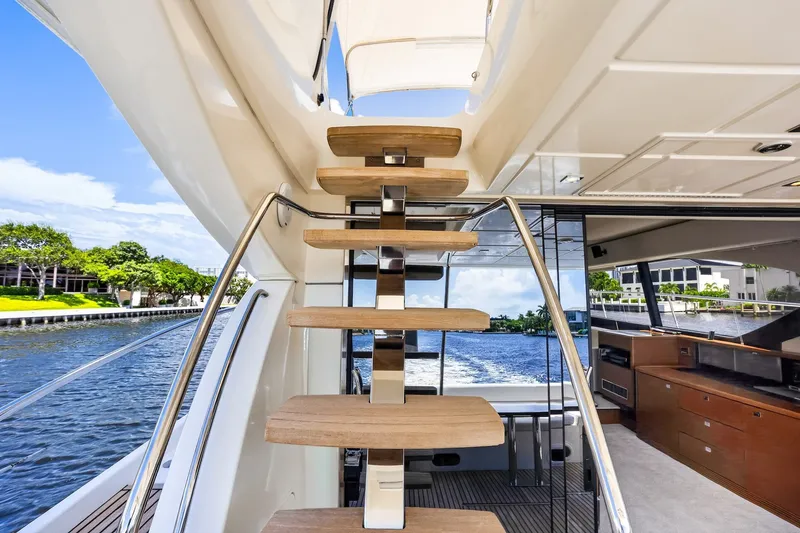 Slide: The Image of Staircase on a 2013 Prestige 620 yacht with scenic waterfront view. - 15