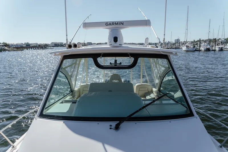 Slide: The Image of 2019 Grady-White Express 330 boat on water, featuring Garmin equipment. - 10